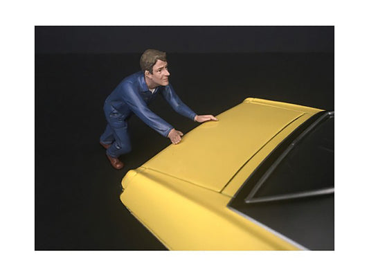 mechanic darwin pushing a car figurine for 1/24 scale models