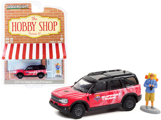 2021 ford bronco sport pink and black "off-roadeo adventure support truck" with backpacker figurine "the hobby shop" series 11 1/64 diecast model car